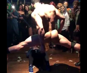 Bulky masculine stripper dancing in the circle of ecstatic