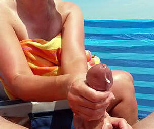 Mature wifey gives brilliant hj on the beach and makes